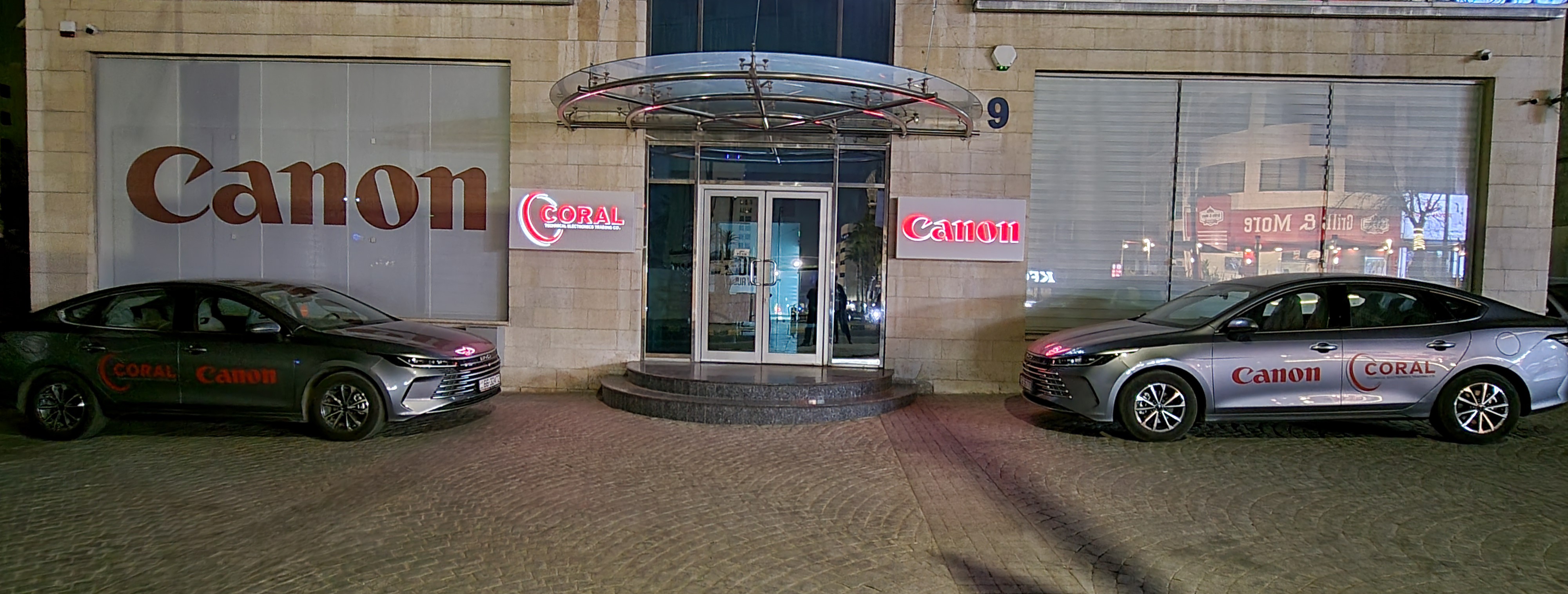 Team collaborating around professional printing equipment